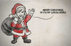 Playing Santa, Mary Fallin hands out lumps of coal Mary Fallin lumps of coal